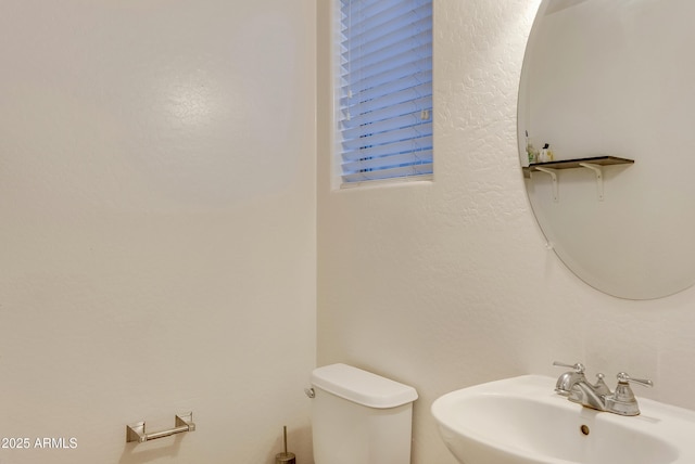 bathroom with toilet and sink