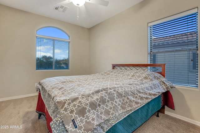 carpeted bedroom with ceiling fan