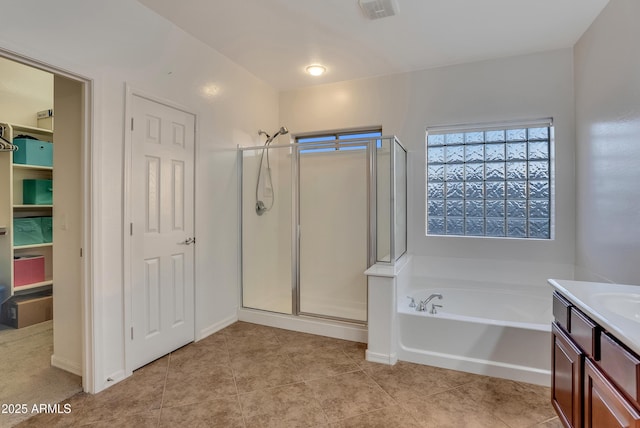 bathroom with vanity, tile patterned flooring, and independent shower and bath