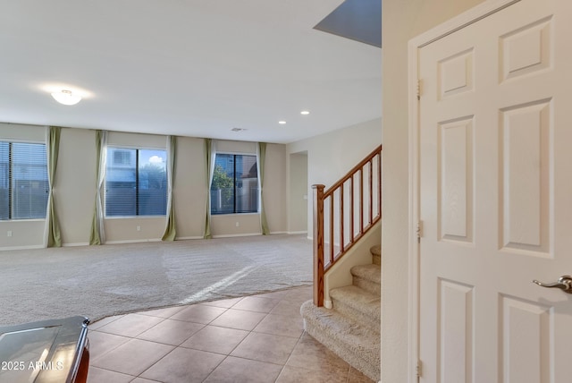 foyer entrance with light carpet