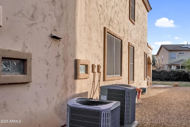 view of property exterior featuring central AC