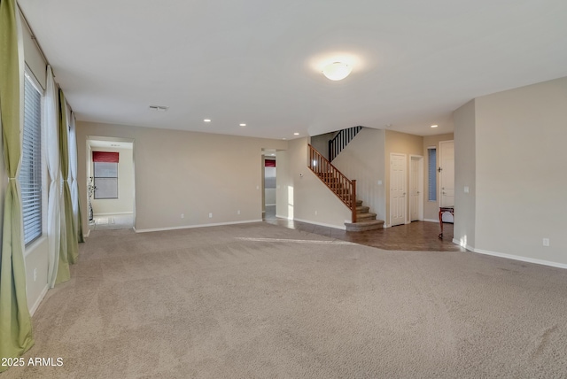 unfurnished living room with light carpet