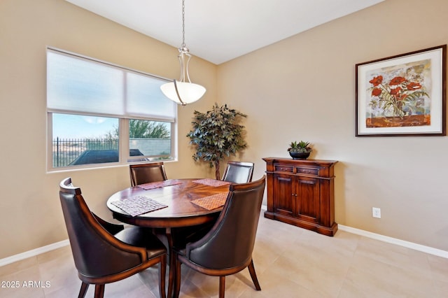 dining space with light tile patterned flooring