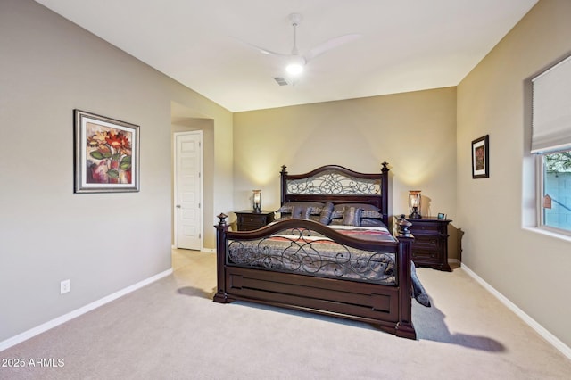 bedroom with ceiling fan and light carpet