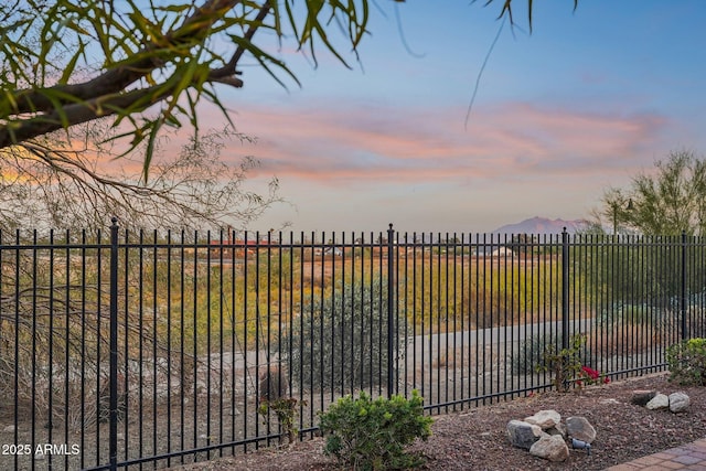 view of gate at dusk