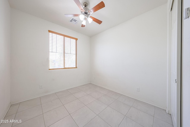 7648 W Kerby Ave, Phoenix, AZ 85043 - spare room featuring a ceiling fan, light tile patterned floors, and baseboards