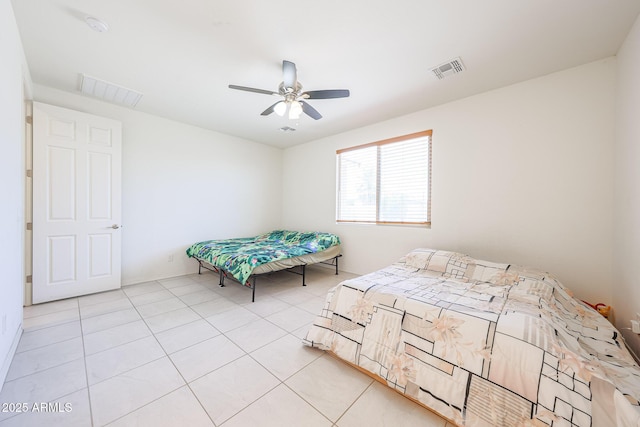 7648 W Kerby Ave, Phoenix, AZ 85043 - bedroom featuring light tile patterned floors and ceiling fan