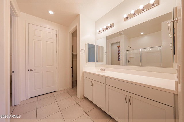7648 W Kerby Ave, Phoenix, AZ 85043 - bathroom featuring vanity, tile patterned flooring, a shower stall, and recessed lighting