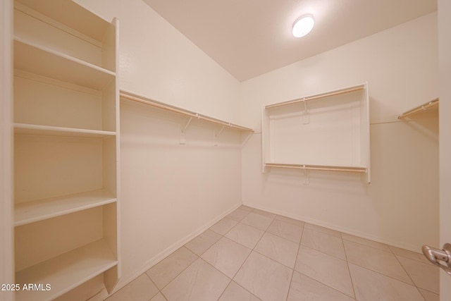 7648 W Kerby Ave, Phoenix, AZ 85043 - walk in closet featuring tile patterned floors