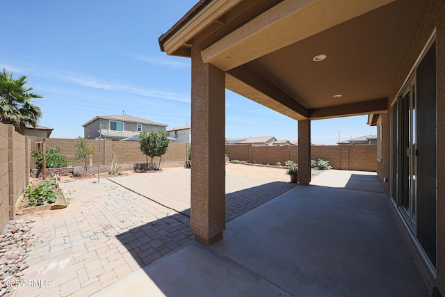 7648 W Kerby Ave, Phoenix, AZ 85043 - fenced backyard featuring a patio area