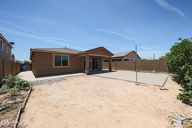 7648 W Kerby Ave, Phoenix, AZ 85043 - rear view of property with a patio, a fenced backyard, and stucco siding