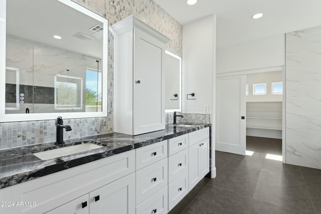 bathroom with a wealth of natural light and vanity