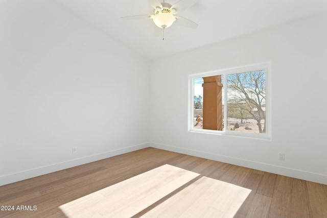 empty room featuring hardwood / wood-style floors and ceiling fan