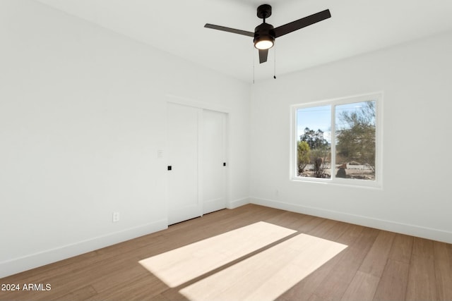 unfurnished room featuring ceiling fan and light wood-type flooring