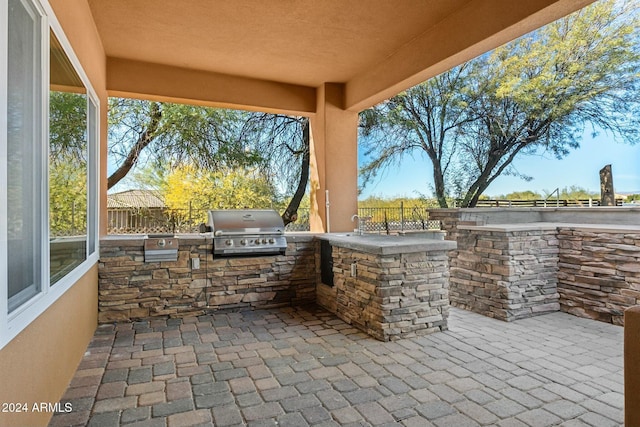 view of patio / terrace with area for grilling and a grill