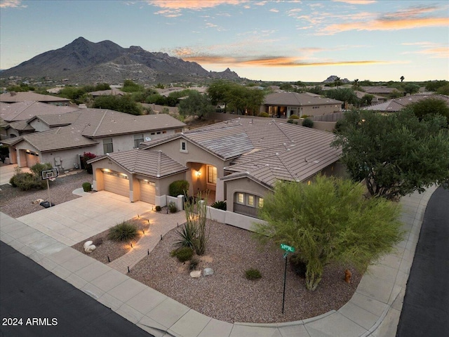 view of front of house featuring a mountain view and a garage