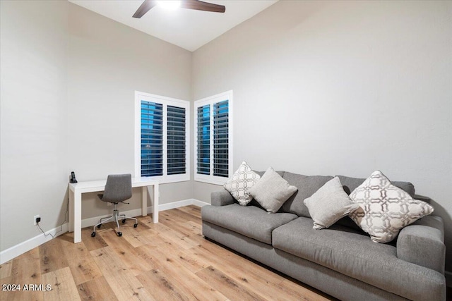 office space with hardwood / wood-style floors, ceiling fan, and vaulted ceiling