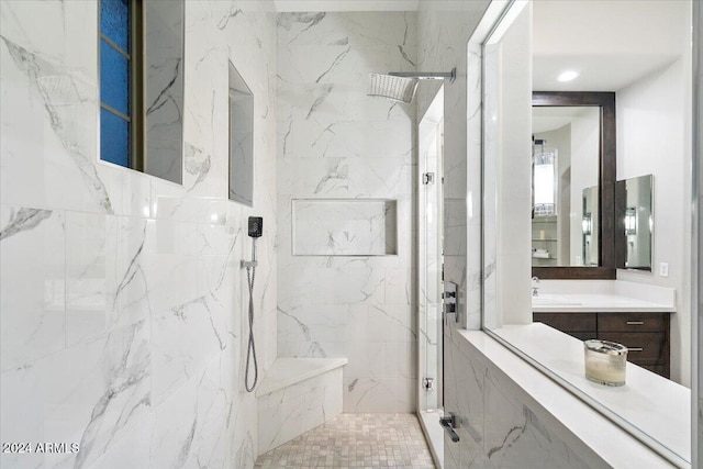 bathroom featuring vanity and a tile shower