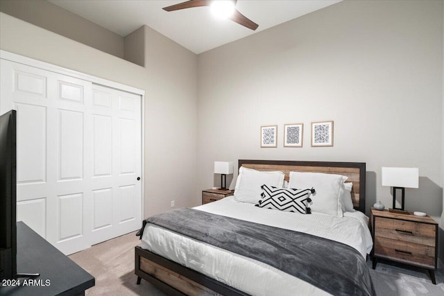 bedroom with a closet, carpet flooring, and ceiling fan