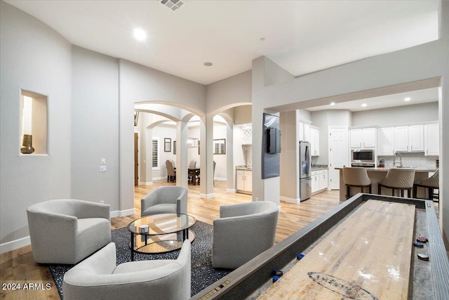 interior space featuring sink and light wood-type flooring