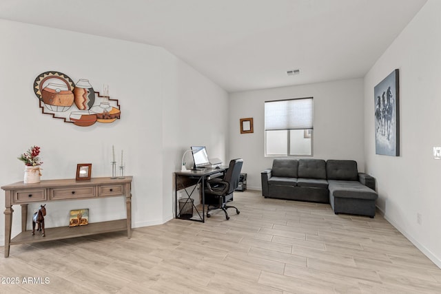 office space with light hardwood / wood-style flooring