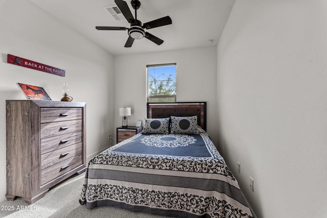 bedroom featuring ceiling fan and carpet