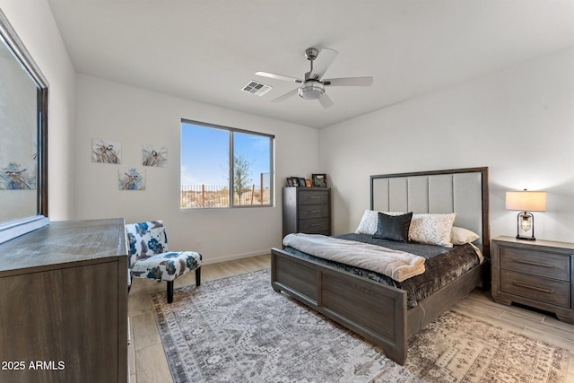 bedroom featuring light wood-type flooring and ceiling fan