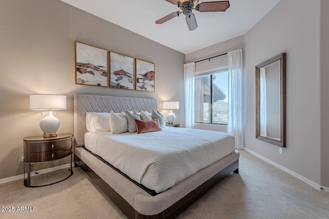 bedroom with a ceiling fan, carpet, and baseboards