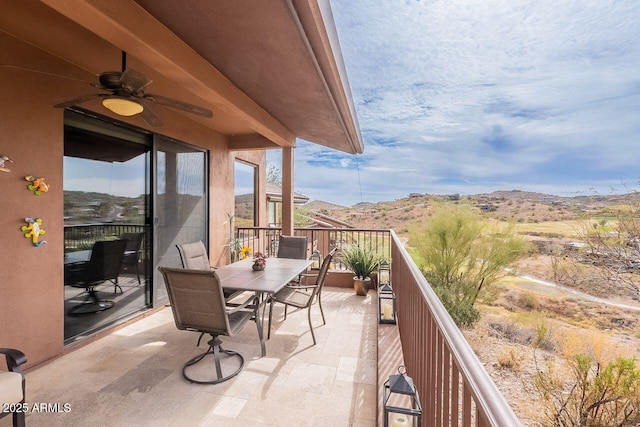 balcony with ceiling fan and a mountain view