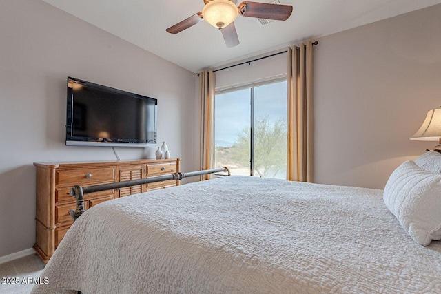 bedroom with carpet, a ceiling fan, and access to exterior