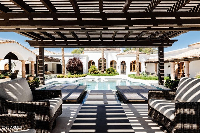 exterior space with an outdoor living space, a pergola, and a patio