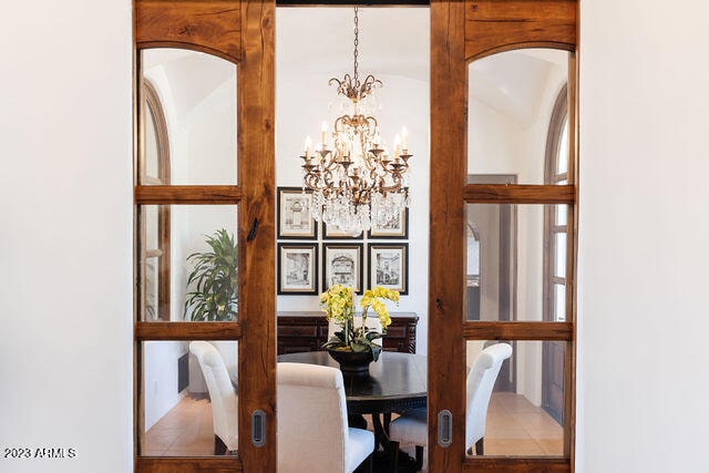 dining space featuring a notable chandelier