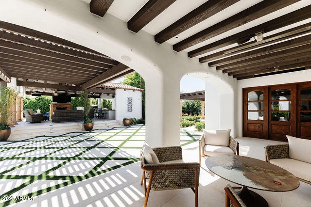 view of patio with an outdoor living space and french doors