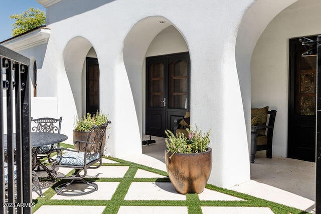 entrance to property with a patio