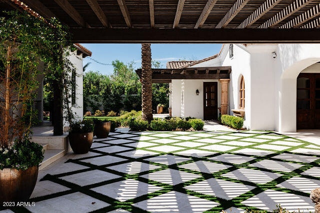 view of terrace with a pergola