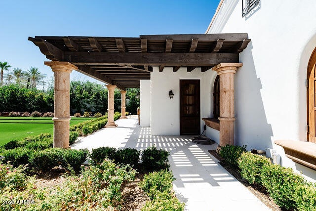 exterior space with a pergola, a patio area, and a yard