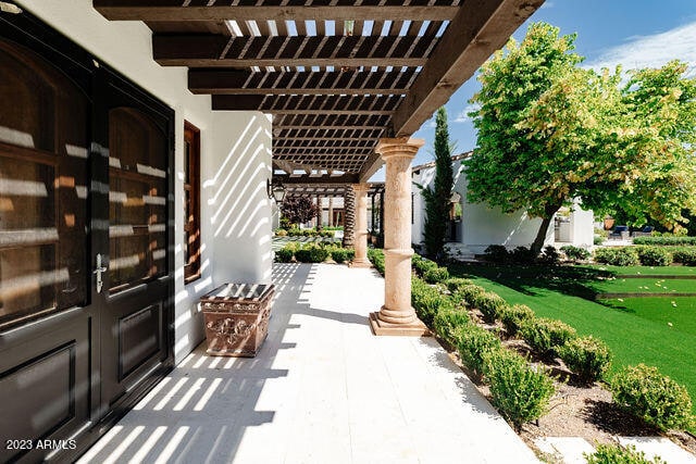 view of terrace with a pergola