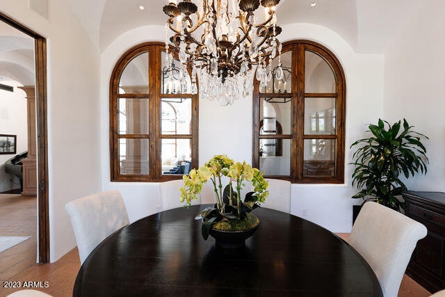 dining space featuring a notable chandelier