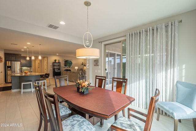 dining area featuring light tile patterned floors