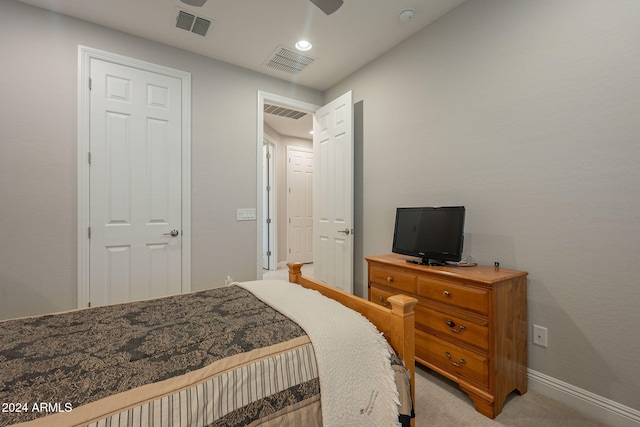 carpeted bedroom with a closet