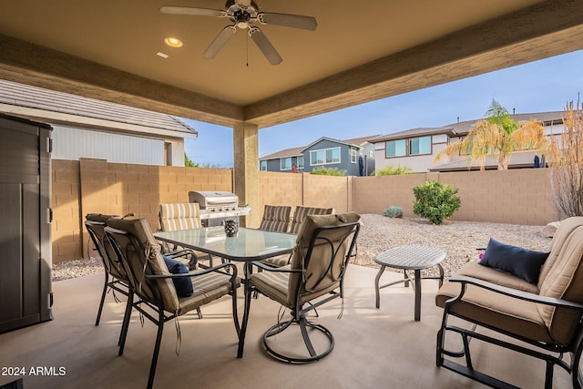 view of patio featuring ceiling fan and a grill