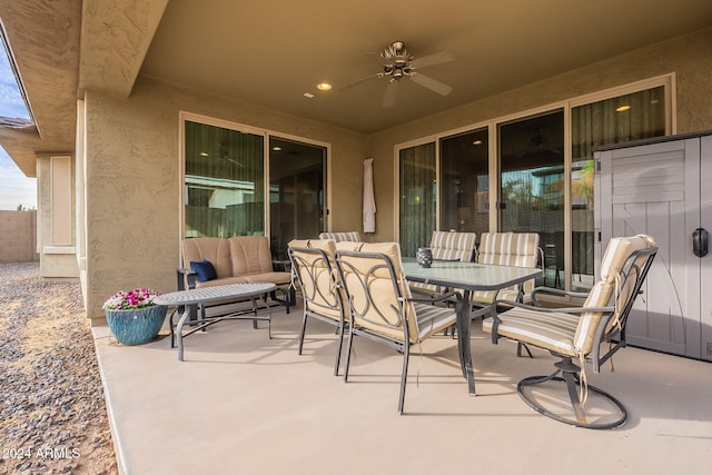 view of patio with ceiling fan and an outdoor living space