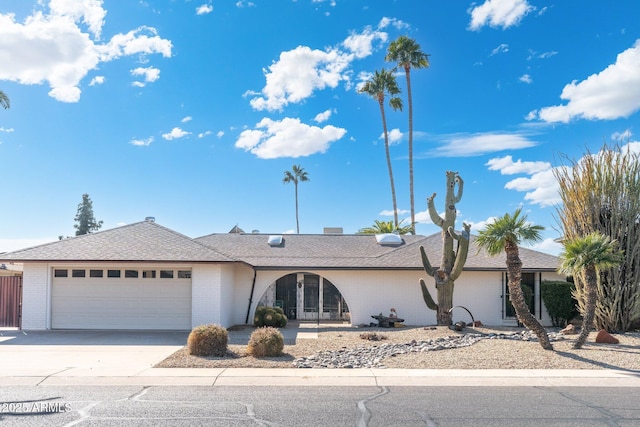 single story home featuring a garage