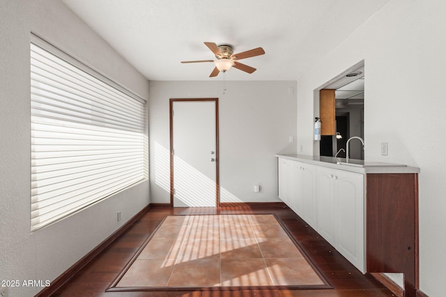 interior space featuring dark hardwood / wood-style floors and ceiling fan