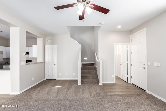 unfurnished living room featuring baseboards, recessed lighting, carpet, and a ceiling fan