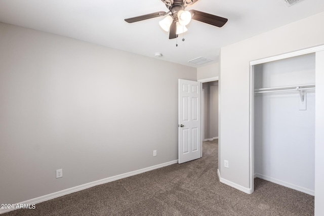 unfurnished bedroom with baseboards, carpet floors, ceiling fan, visible vents, and a closet