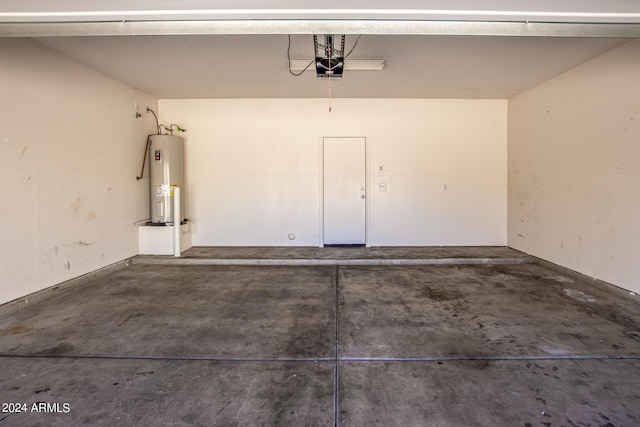 garage featuring water heater and a garage door opener