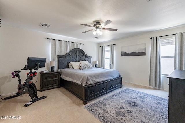 bedroom with light colored carpet and ceiling fan