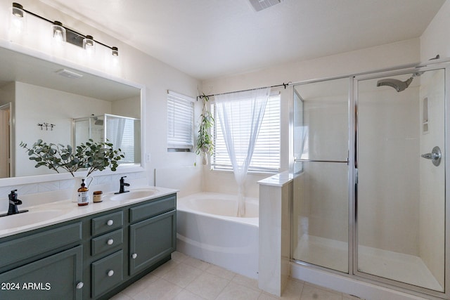 bathroom with vanity, plus walk in shower, and tile patterned flooring