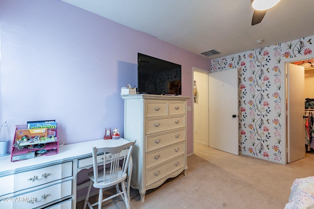 office space featuring light colored carpet and ceiling fan